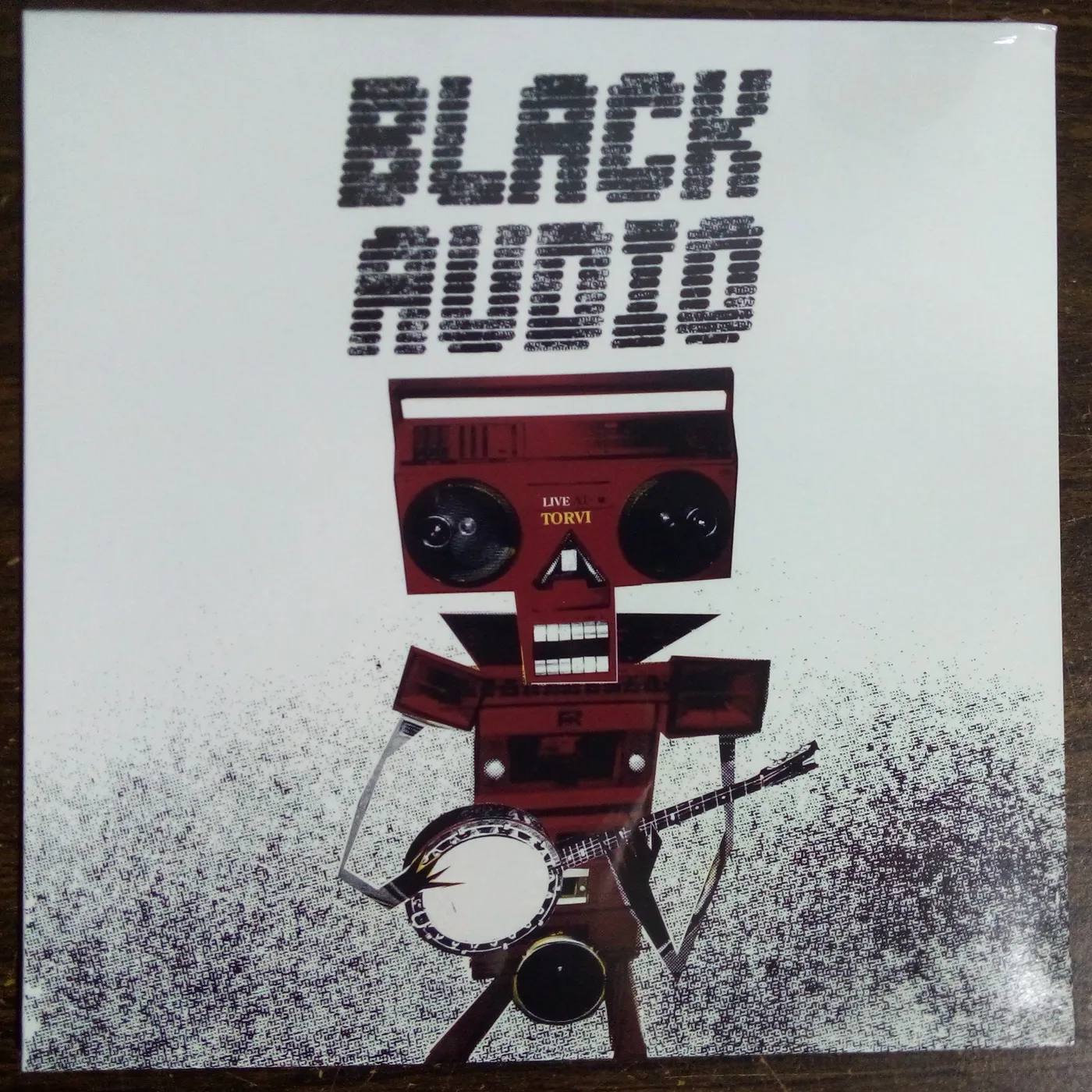 Black Audio ‎– Live At Torvi 10" - the edges of the cover have very light wear & the cover has very light crease marks from shipping to the vendor